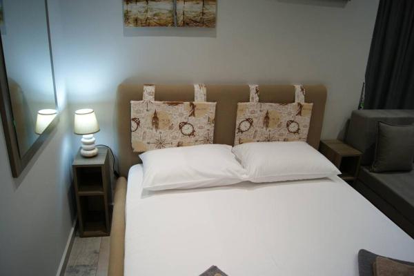 A la foto es mostra l'objecte Cozy City House situat a la ciutat de Volos.
