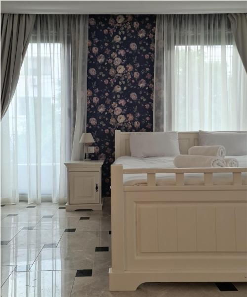 The photo shows the Kaleidoscope Boutique Hotel located in the city of Canalu.