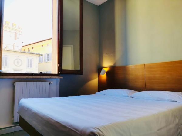 På billedet ses objektet Hotel La Perla beliggende i byen Siena.