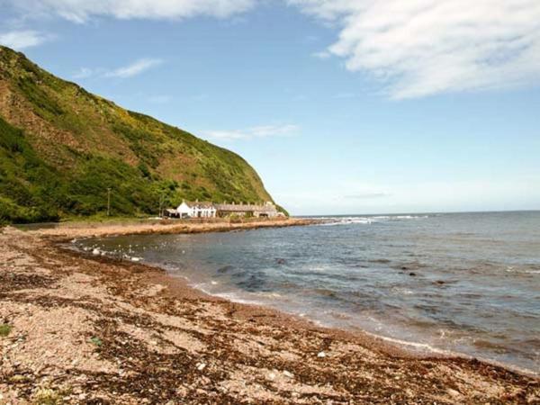 A la foto es mostra l'objecte The Cottage By The Sea, Scotland situat a la ciutat de Lamberton.