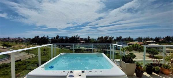 På billedet ses objektet Cobertura Carpe Diem: Jacuzzi Conforto no Campeche beliggende i byen Florianópolis.