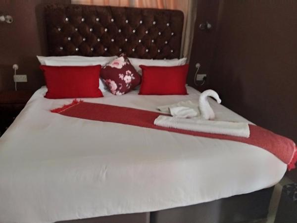 Op de foto is het object Impovu Guest House te zien, gelegen in de stad Lesoma.