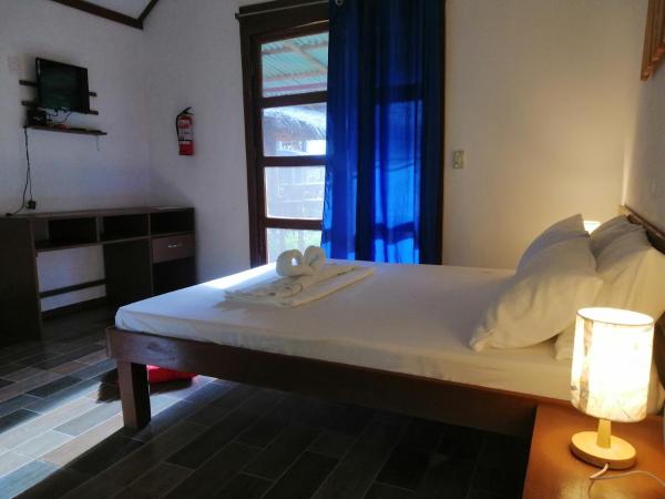 The photo shows the Genevieve Guest House and Tours located in the city of Capalasanan.