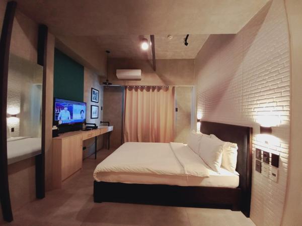 A la foto es mostra l'objecte Affable 1BR Service Apartment 2px allows 5Px 19088 situat a la ciutat de Manila.