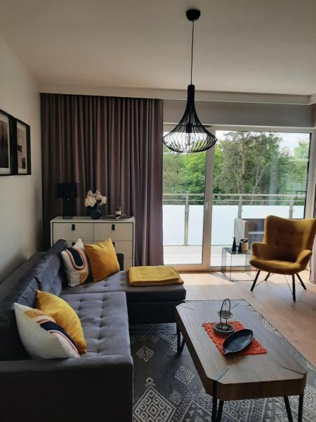 The photo shows the Luksusowy Apartament Parkowa Olecko located in the city of Olecko.