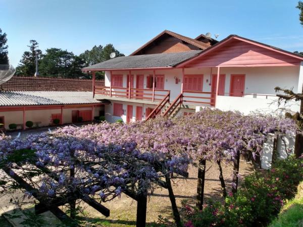 The photo shows the Apartamentos Aromas de Gramado - Bairro Centro located in the city of Gramado.