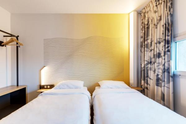 Na zdjęciu widoczny jest obiekt B&B HOTEL Reims Bezannes położony w mieście Reims.