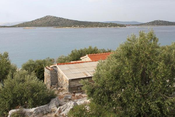 The photo shows the Seaside secluded house with a swimming pool Cove Vitane, Pasman - 8481 located in the city of Tkon.