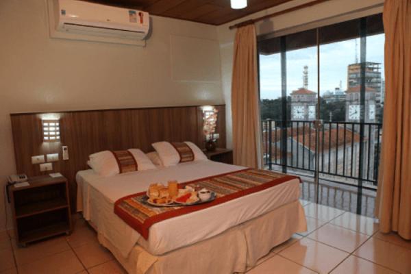 The photo shows the Mato Grosso Palace Hotel located in the city of Cuiabá.
