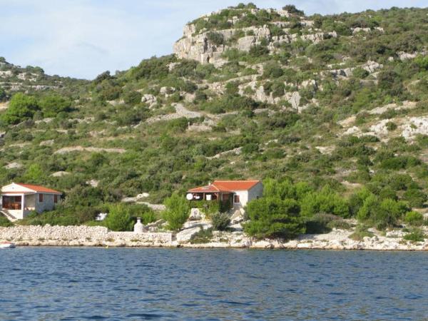 The photo shows the Secluded fisherman's cottage Cove Donje More, Pasman - 11602 located in the city of Tkon.