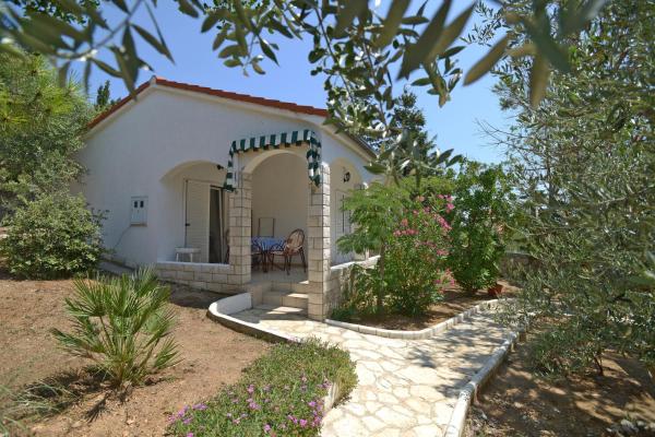 The photo shows the Apartments by the sea Mandre, Pag - 12567 located in the city of Mandre.