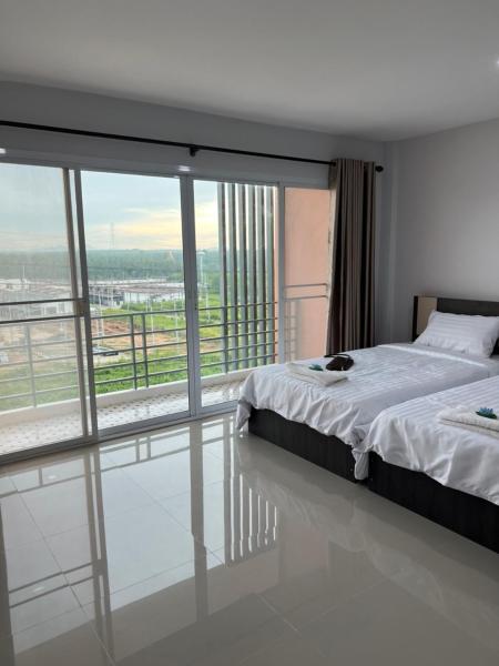 A la foto es mostra l'objecte Thana Apartment situat a la ciutat de Ban Rawoeng.