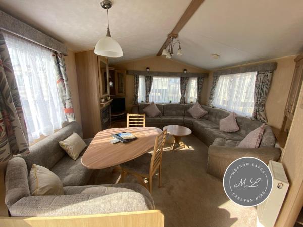 På billedet ses objektet Coral Beach - Row 73 Van 2, central heating, WiFi, bed linen - Meadow Lakes Caravan & Lodge Hire beliggende i byen Ingoldmells.