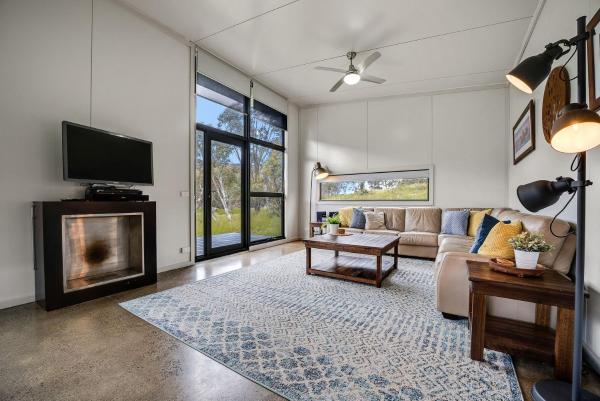 The photo shows the Ecocrackenback 3 Sustainable chalet close to the slopes located in the city of Crackenback.