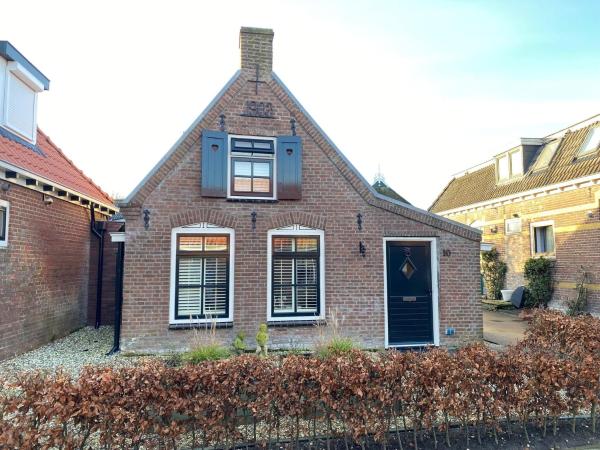 Na foto é possível ver o objeto Holiday home by the Wadden Sea localizado na cidade de Paesens.