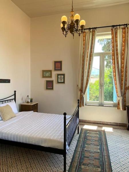 Na fotografii je vidět objekt Yioklima - Renovated Neoclassical House with two bedrooms nacházející se ve městě Vámos.