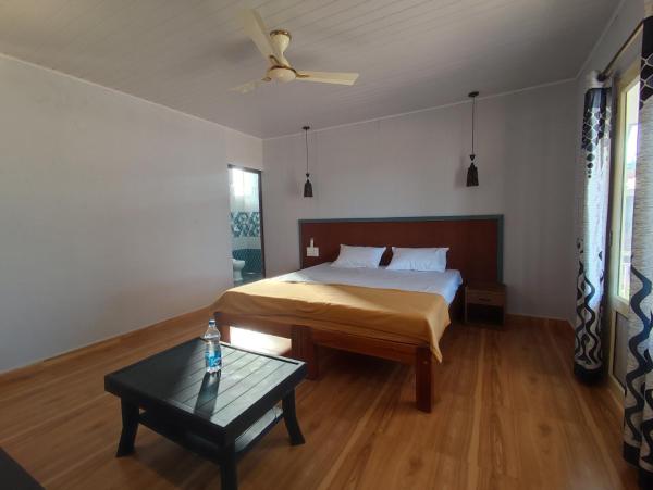 A la foto es mostra l'objecte Coral Beach Cottage situat a la ciutat de Māvalli.