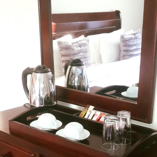 The photo shows the Deluxe Guest House located in the city of Gaborone.
