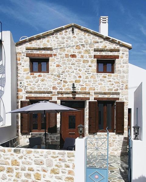 The photo shows the A Rock house at Piles village Karpathos - Πέτρινο σπίτι στο χωριό Πυλές Κάρπαθος located in the city of Óthos.