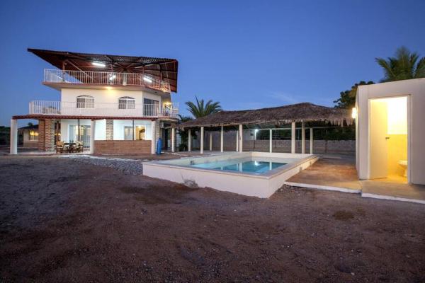 En la foto se muestra el objeto Casa Centenario: Lovely 3br home w/ heated Pool great for families ubicado en la ciudad de El Quelele.