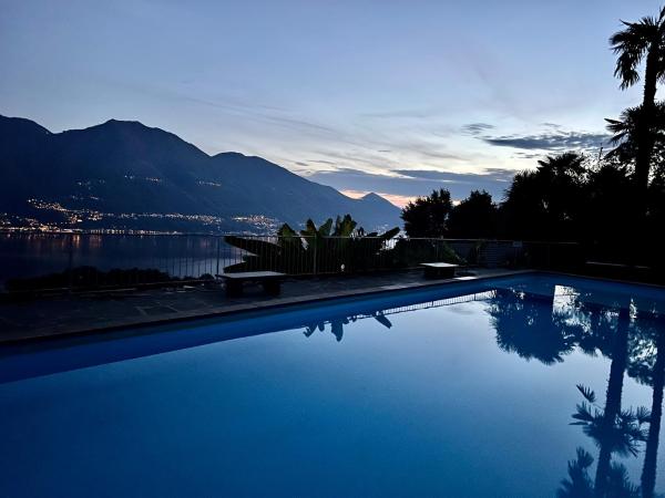 Na fotografii je vidět objekt Wohnung mit Aussicht auf Lago Maggiore & Pool nacházející se ve městě Contra.