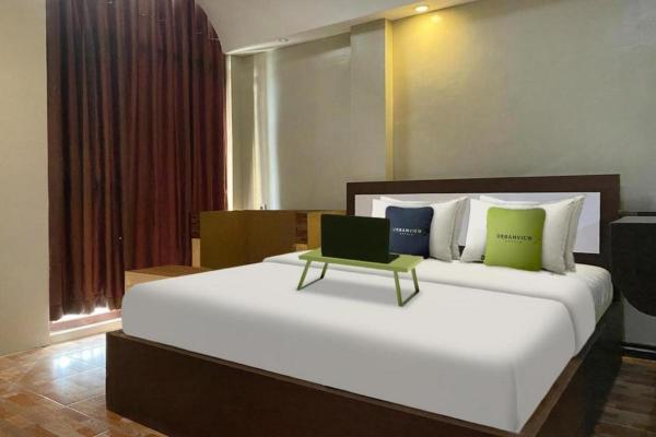 На фото показан объект Urbanview Hotel Sabang Land Syariah Jayapura, расположенный в городе Abepura.