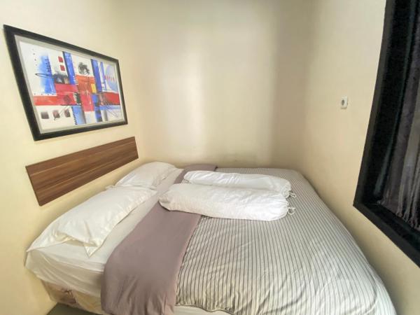 Kuvassa näkyy kohde De Homestay Mitra RedDoorz Bitung, joka sijaitsee kaupungissa Airtembaga.