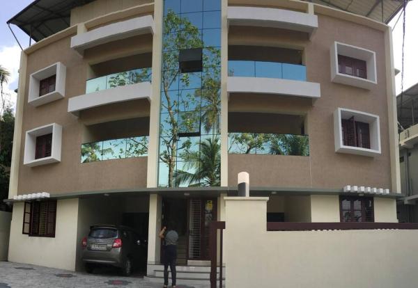 The photo shows the Athrakkattu Enclave 6 Bedroom Luxury Apartment located in the city of Vempayam.