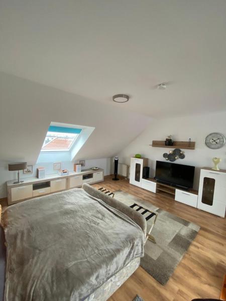 A la foto es mostra l'objecte Dachgeschoss Apartment mit Ausblick situat a la ciutat de Büschdorf.