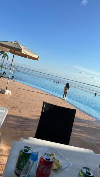 Kuvassa näkyy kohde Apartamento no tropical executive hotel com varanda, 1 cama de casal e 2 camas de solteiro, joka sijaitsee kaupungissa Manaus.