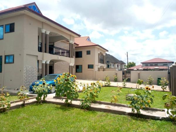 The photo shows the Stunning Executive 2 Bedroom Apartment with KING SIZE BED located in the city of Asiempong.