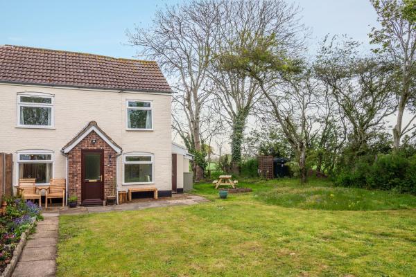 A la foto es mostra l'objecte Margarets Cottage situat a la ciutat de Potter Heigham.