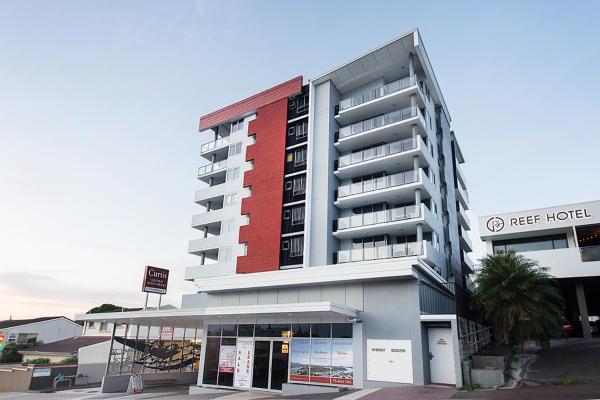 The photo shows the Curtis Central Apartments Official located in the city of Mount Larcom.