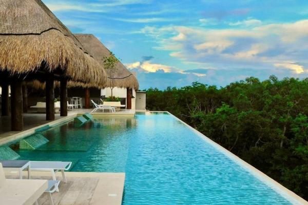 Na foto é possível ver o objeto 1 Rec. | Vista a la Jungla + Piscina Infinita + Amenidades LX localizado na cidade de Tulum.