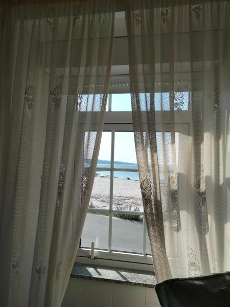 Na zdjęciu widoczny jest obiekt Casa de Playa en Corrubedo położony w mieście Corrubedo.