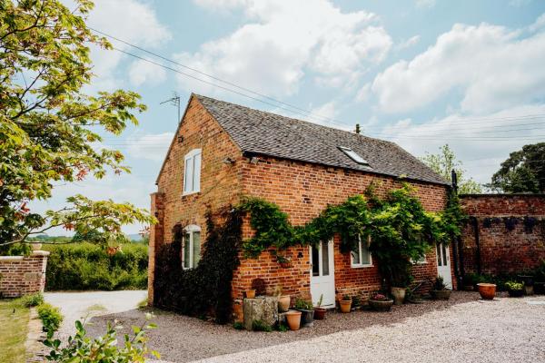 A la foto es mostra l'objecte The Coach House Barn situat a la ciutat de Condover.