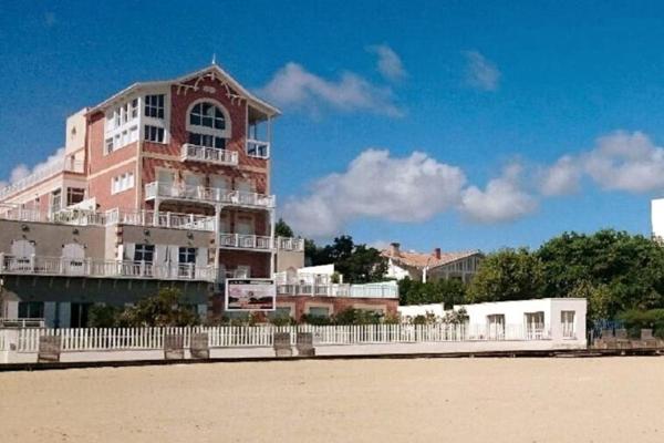 A la foto es mostra l'objecte Arcarêve - Grand Studio Deluxe avec terrasse, jardin et accès plage situat a la ciutat de Arcachon.