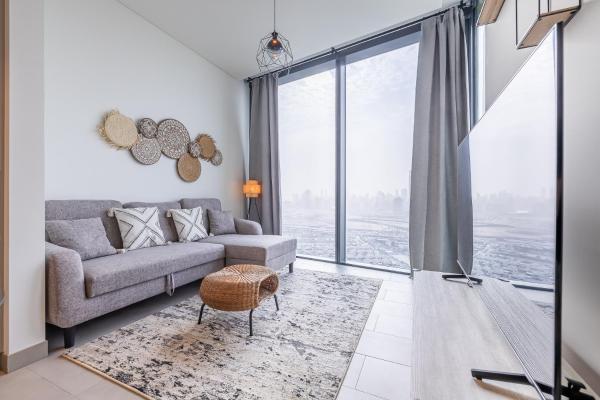 Na fotografii je vidět objekt Sobha Hartland Waves I 1 Bedroom Apartment I Burj Khalifa View nacházející se ve městě Dubaj.