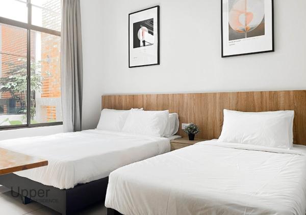 På billedet ses objektet Upper Residence Homestay in Ujong Pasir Melaka, 4 bedrooms, 14pax beliggende i byen Kampong Pasir.