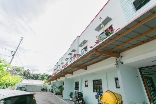 The photo shows the Midway Stay Apartments Dumaguete located in the city of Talay.