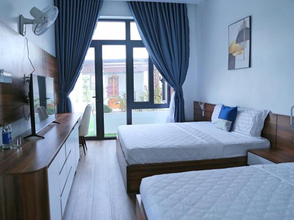 A la foto es mostra l'objecte QV Manor Homestay situat a la ciutat de Phan Rang.