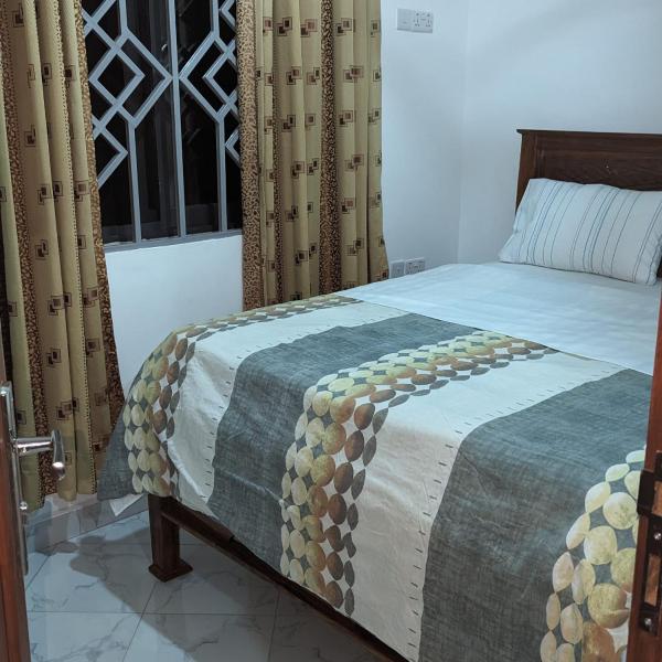 The photo shows the Mufasa city Apartments located in the city of Arusha.