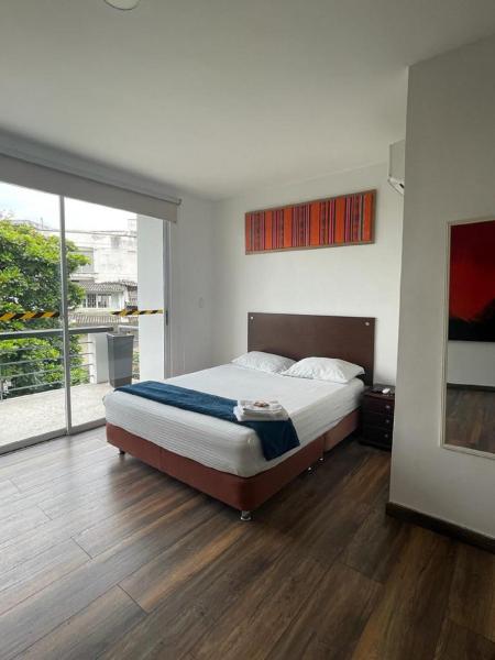 На фото показан объект Ayenda Apartamento Turistico Distrito 9 90, расположенный в городе Кали.