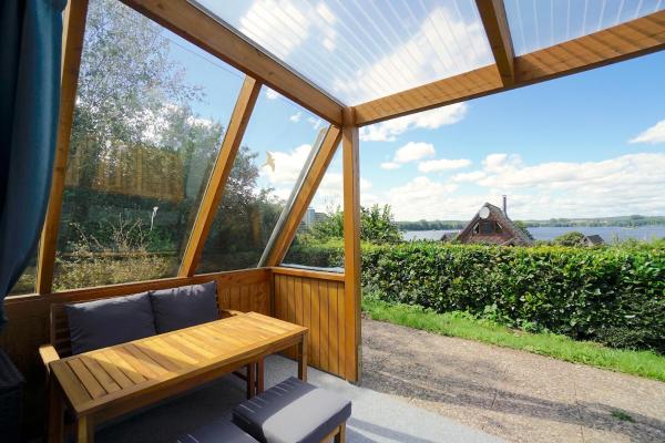 На фото показан объект Ferienhaus Nurda - Seeblick am Wittensee, расположенный в городе Bünsdorf.