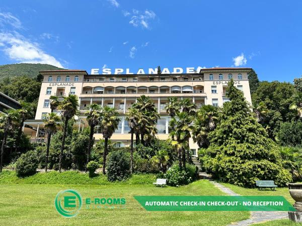 На фото показан объект E-Rooms Minusio, расположенный в городе Локарно.