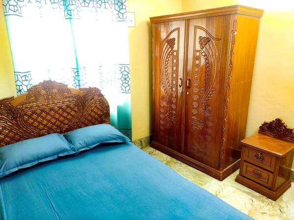 The photo shows the Asma-ul-husna apartment located in the city of Rāmchandrapur.