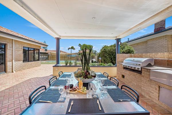 The photo shows the Your Sunny Pool & Ocean Escape located in the city of Spearwood.