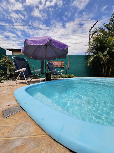 På billedet ses objektet Toca da Suzara Suíte 3 até 3 pessoas Piscina Rio e Mar num só lugar beliggende i byen Florianópolis.