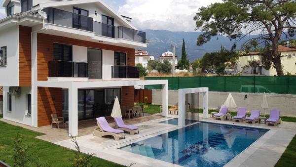 The photo shows the Hisar Prestige A located in the city of Fethiye.