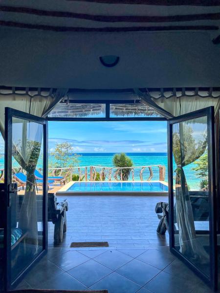 Na foto é possível ver o objeto Zi Villa Beach Cottage localizado na cidade de Matemwe.
